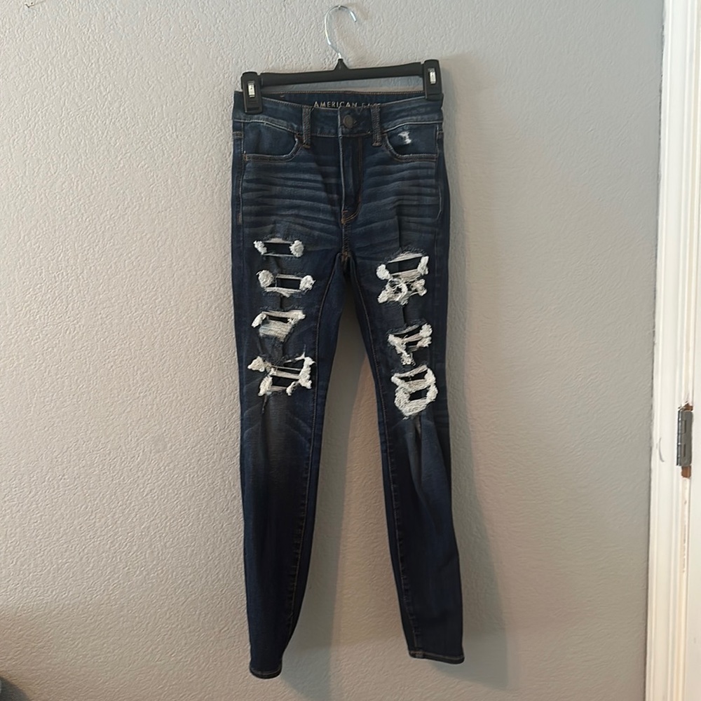 American Eagle women’s dark wash jeans with fake rips in size 0